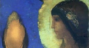 Portrait de profil d&rsquo;une fille indienne au teint marron et aux cheveux noir tr&egrave;s raides avec &agrave; la hauteur de l&rsquo;oreille des bijoux brillants. Elle est aur&eacute;ol&eacute;e de papier d&rsquo;or. Le reste du fond est bleu fonc&eacute;, avec une tache dor&eacute;e ovale en hauteur sur le c&ocirc;t&eacute; gauche. 